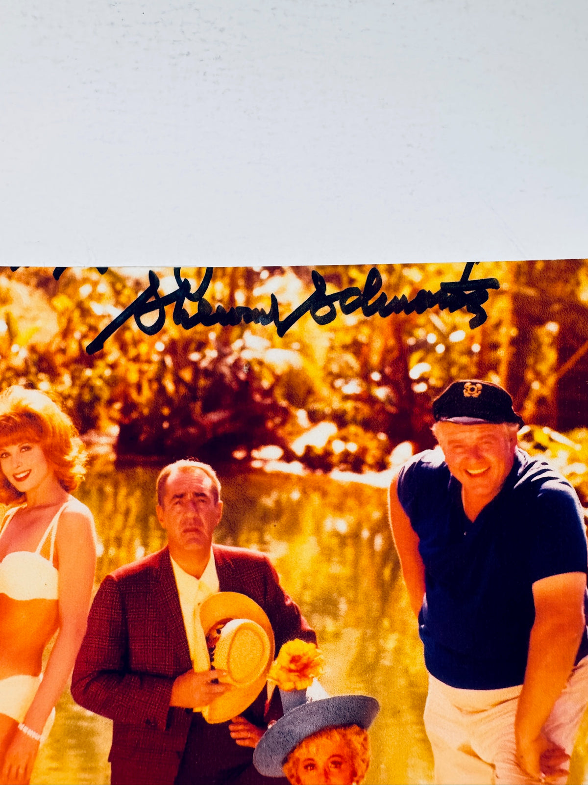 Cropped upper section of signed Gilligan's Island photo showing the autograph above cast members.