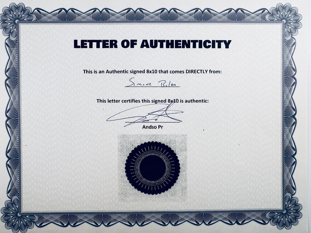 Letter of Authenticity with a decorative blue-patterned border, certifying an authentic signed 8x10 coming directly from Simone Biles, featuring a signature and a dark circular seal graphic at the bottom.