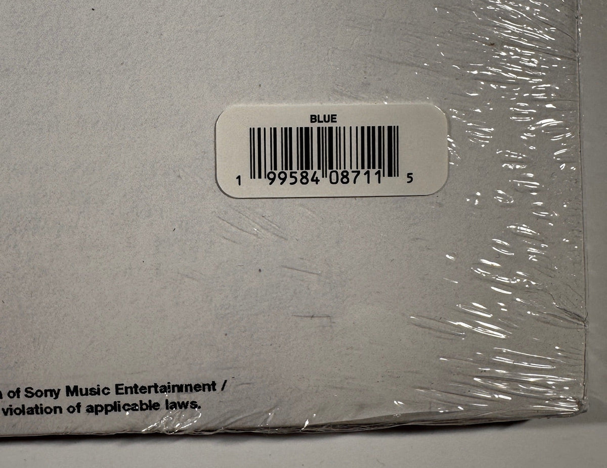Close-up of the back cover barcode sticker indicating the "BLUE" vinyl color variant (UPC 199584087115).