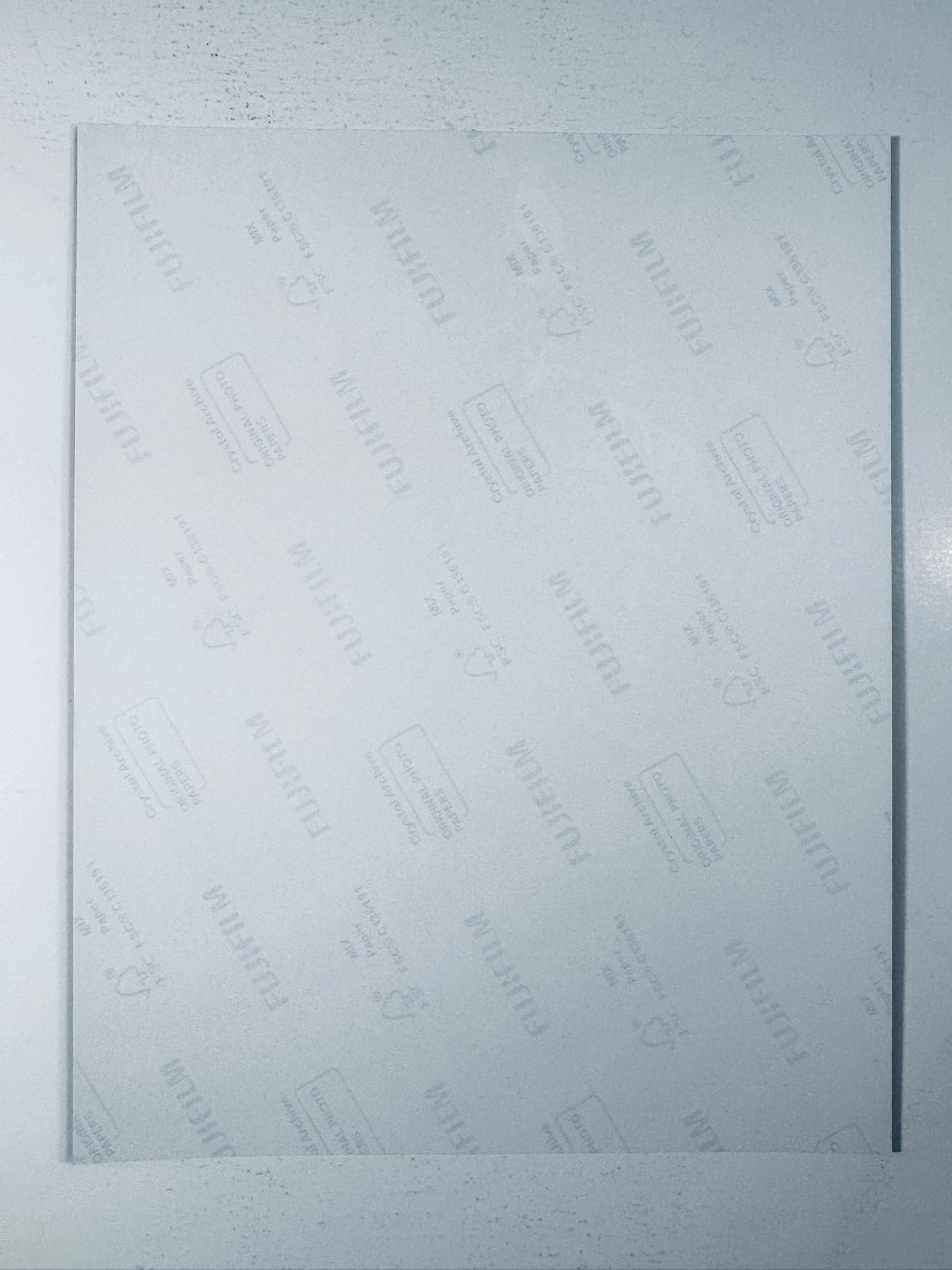 Back of the Fujifilm photographic paper showing the reverse side condition and paper branding for the Tom Hardy signed The Dark Knight Rises collectible.