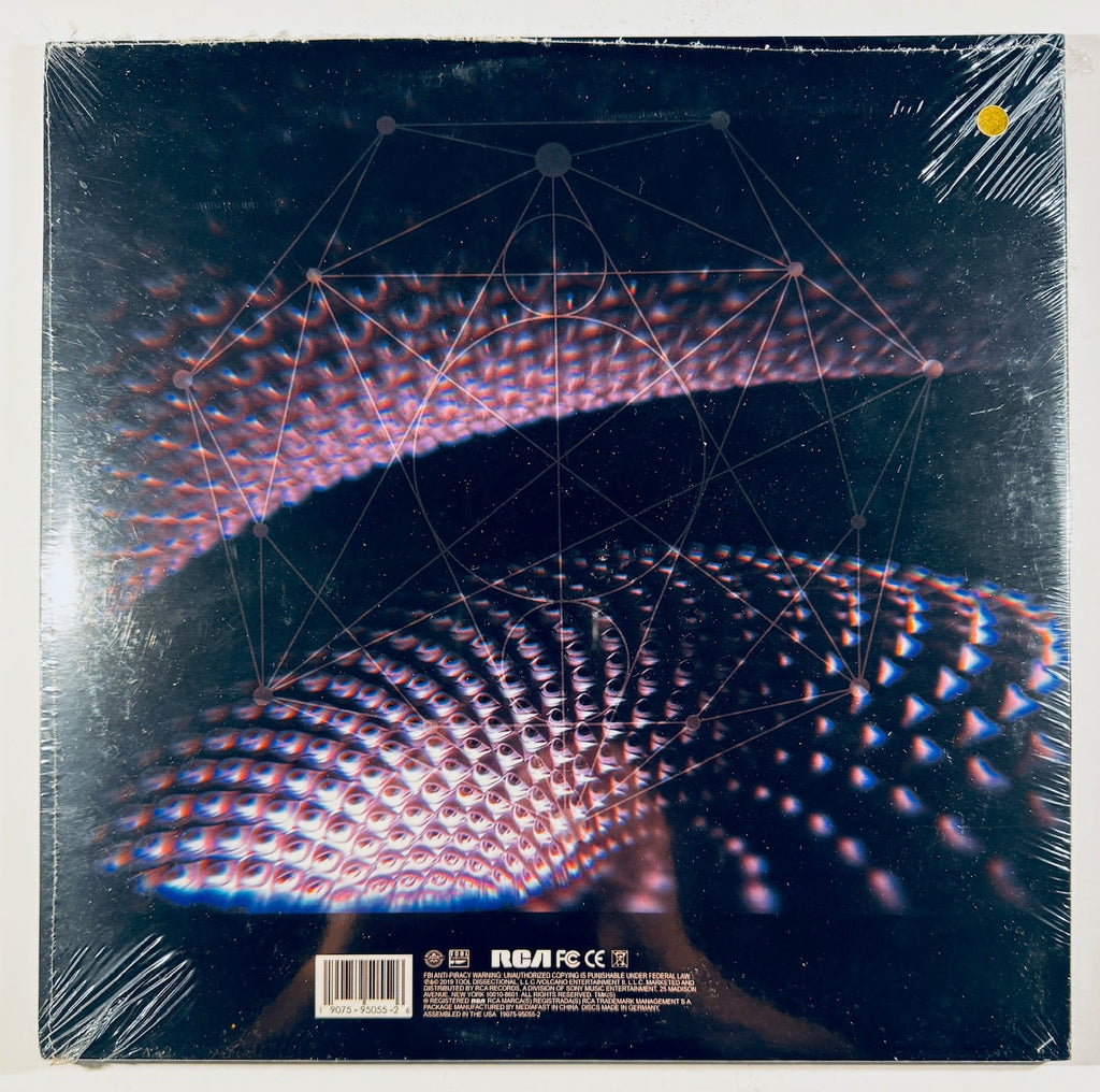 Back cover and physical condition of the unofficial gold vinyl release of Tool's Fear Inoculum showing geometric designs and barcode details.