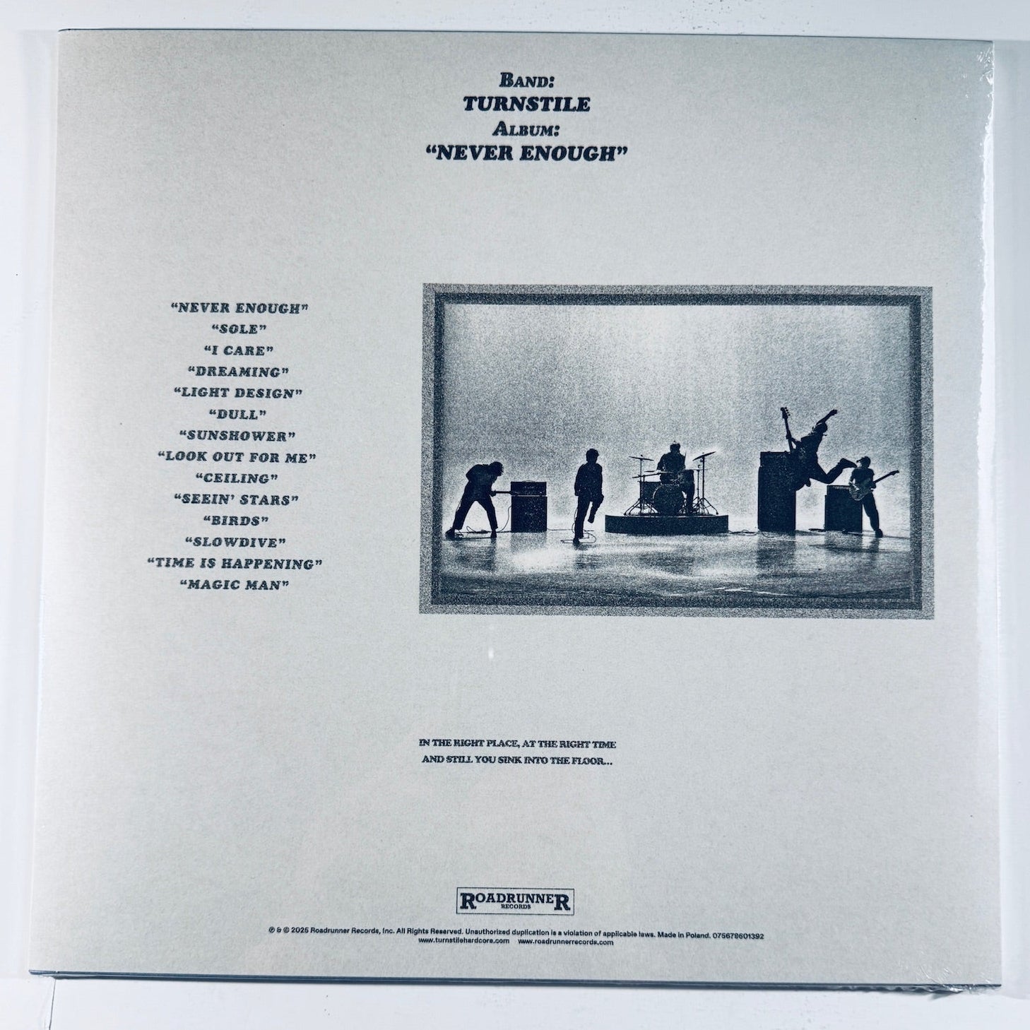 Back cover showing the tracklist, band silhouette photo, and Roadrunner Records branding for the Turnstile Never Enough vinyl record.