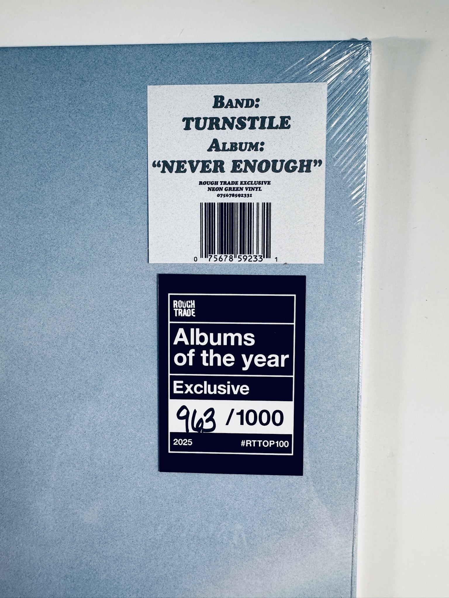 Close-up of the UPC barcode 075678592331 and hand-numbered 963 out of 1000 exclusive sticker on the Turnstile Never Enough vinyl record.