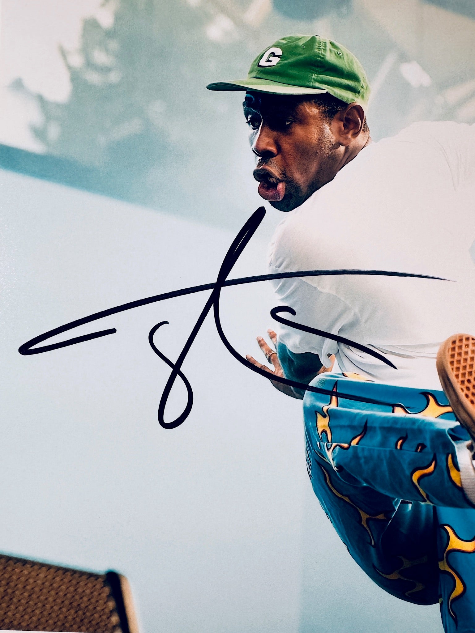 Close-up of Tyler, The Creator's signature in black marker on the signed live performance 8x10 photo.