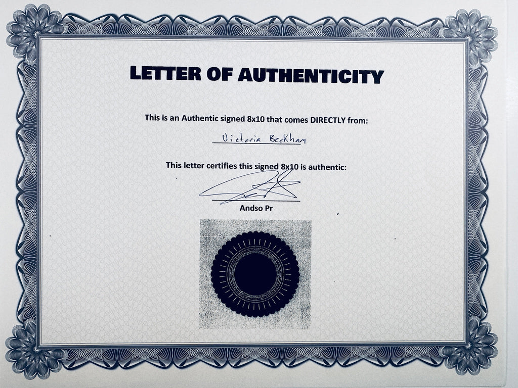 A Letter of Authenticity with a decorative blue-patterned border, certifying an authentic signed 8x10 coming directly from Victoria Beckham, featuring a signature and a dark circular seal graphic at the bottom.