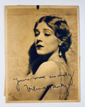 Vintage sepia studio portrait photo of silent film actress Vilma Bánky featuring a printed facsimile stamped signature.