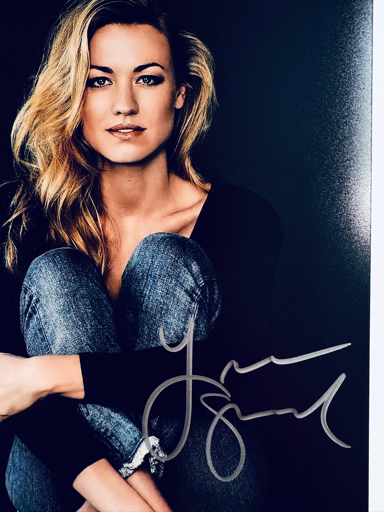 Close-up view of Yvonne Strahovski's signature in silver marker across the promotional matte photo.
